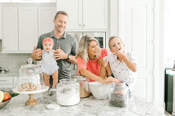 Krista with husband and two children in the kitchen