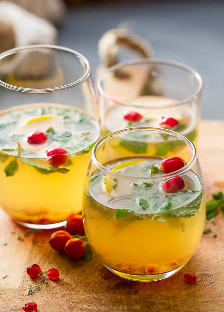 photo of a group of classes filled with lime mint kombucha cocktail