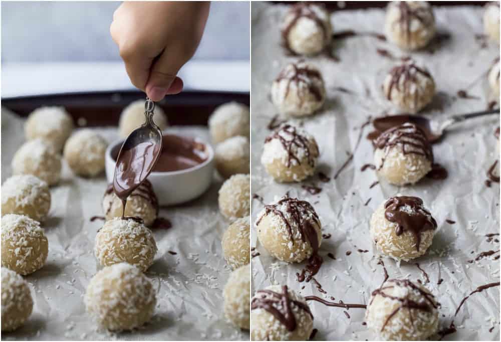 chocolate being drizzled on almond snowball cookies while on parchment paper