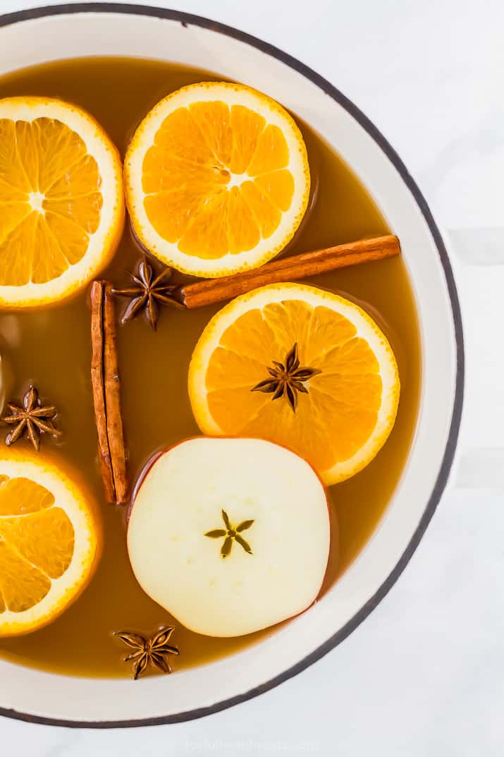 hot spiked mulled apple cider in a big dutch oven pot