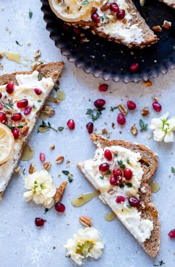 overhead photo of pomegranate honey ricotta toast