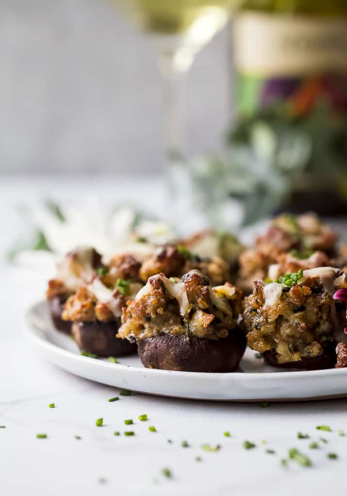 photo of cheesy sausage stuffed mushrooms on a plate