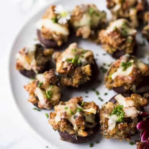 photo of cheesy sausage stuffed mushrooms on a plate