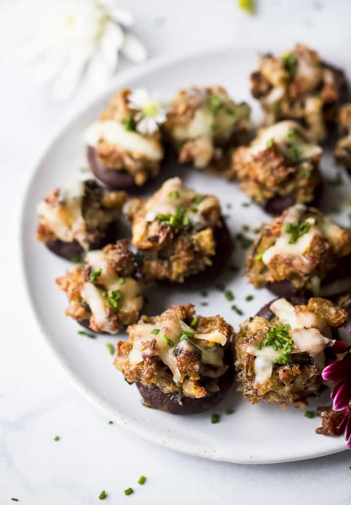 photo of cheesy sausage stuffed mushrooms on a plate