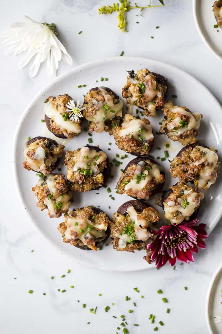 overhead photo of cheesy sausage stuffed mushrooms on a plate