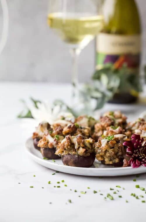 photo of cheesy sausage stuffed mushrooms on a plate