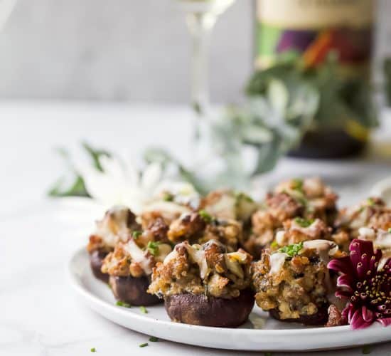 photo of cheesy sausage stuffed mushrooms on a plate