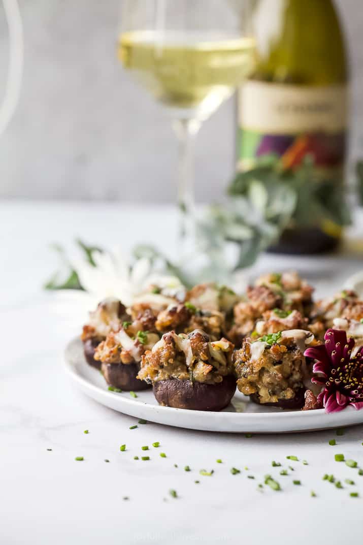 photo of cheesy sausage stuffed mushrooms on a plate