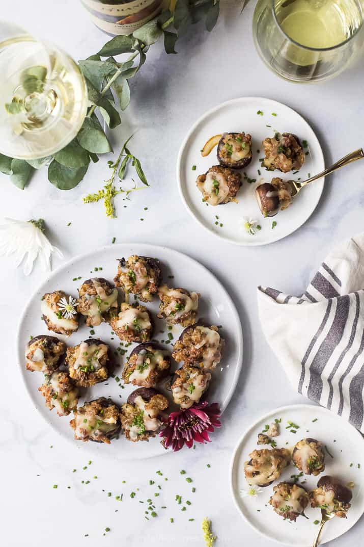 overhead photo of cheesy sausage stuffed mushrooms on a plate