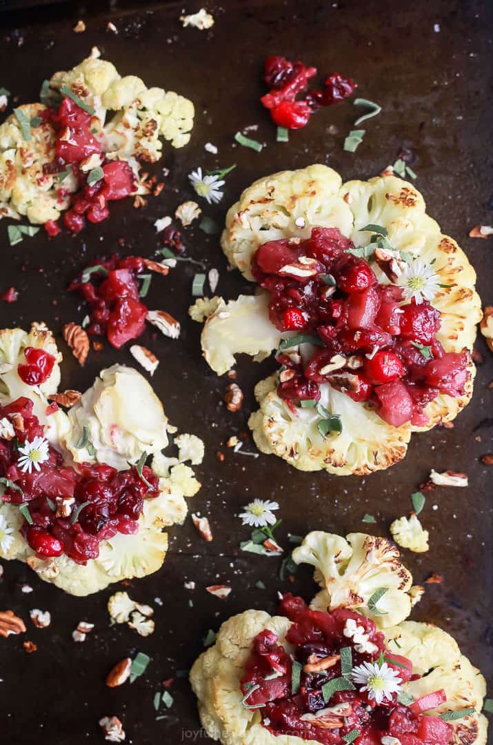 overhead photo of roasted cauliflower steaks with a cranberry apple chutney