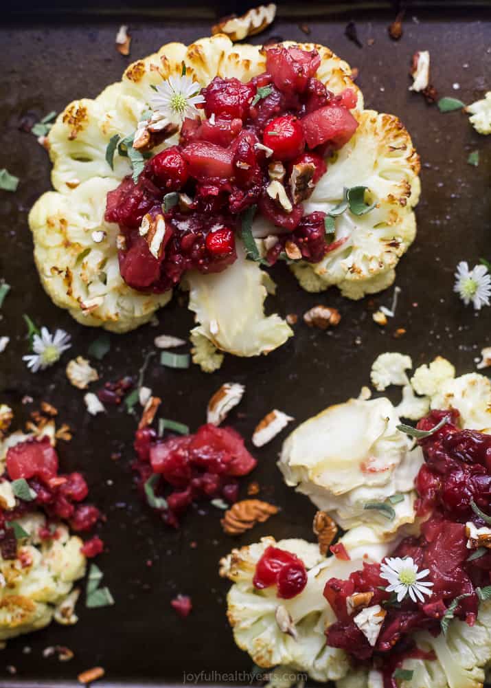 overhead photo of roasted cauliflower steaks with a cranberry apple chutney