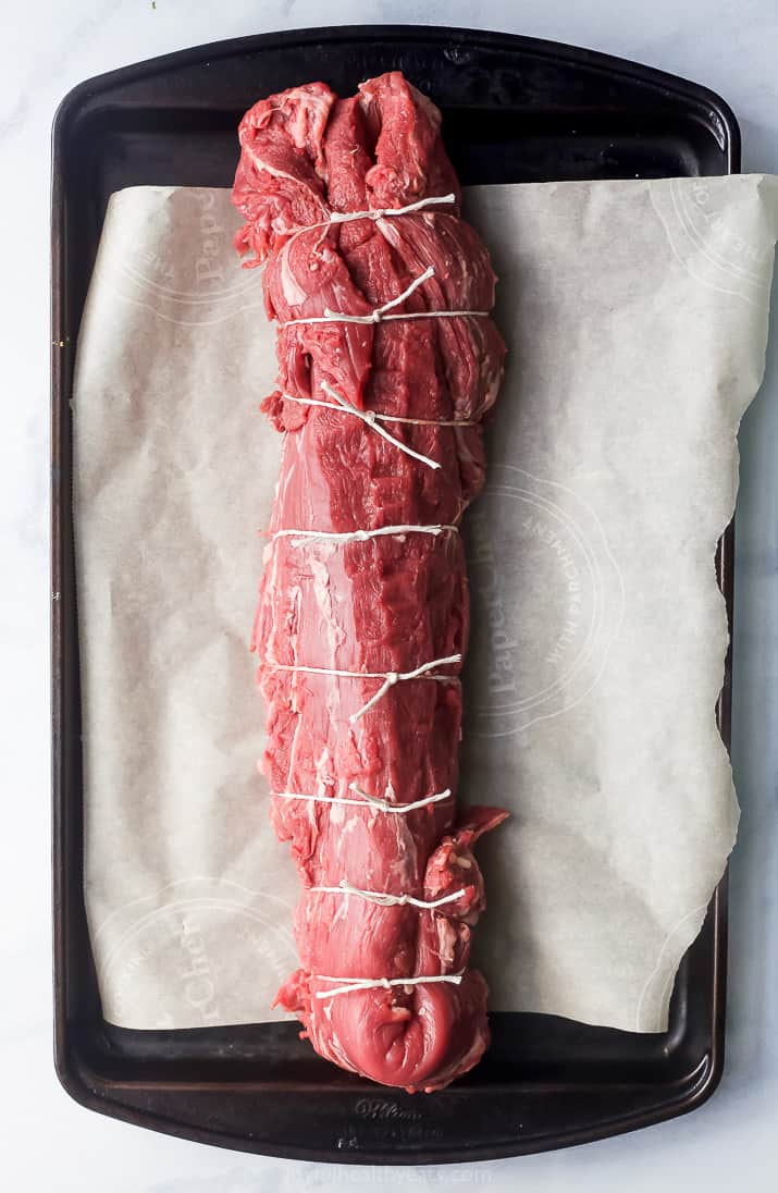 Trimmed beef tied with butcher's twine. 