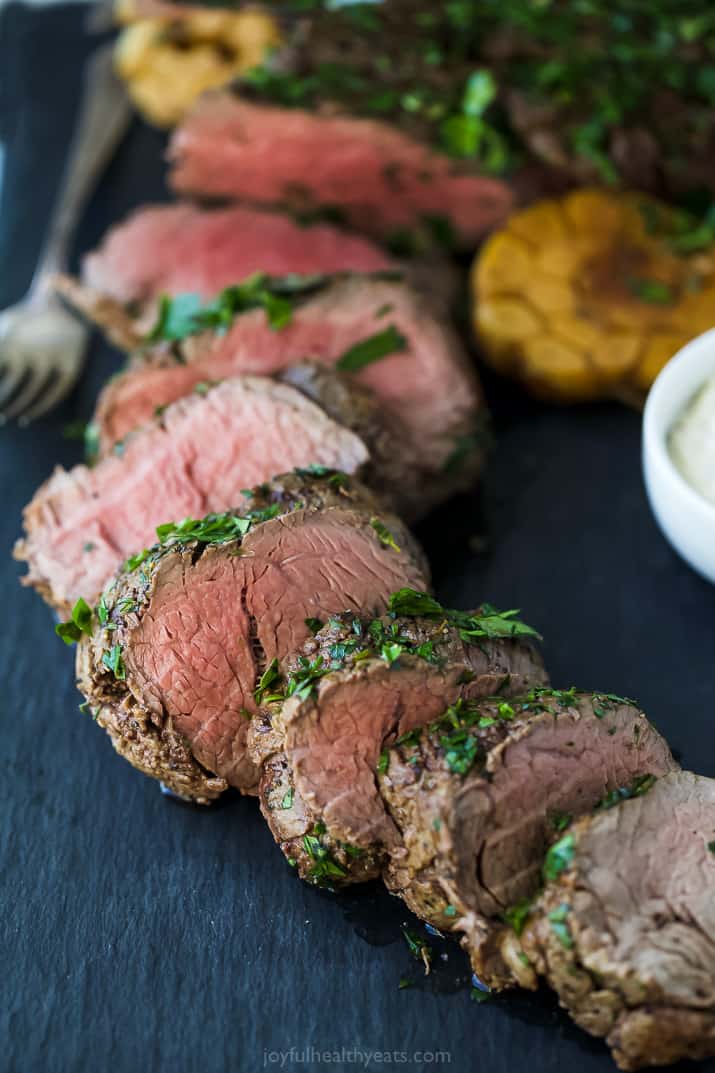 Sliced beef tenderloin with an herb crust.  