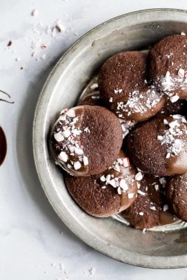 gluten free chocolate cookies sprinkled with peppermint candy in a serving dish