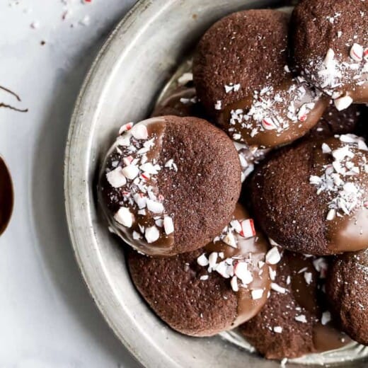 gluten free chocolate cookies sprinkled with peppermint candy in a serving dish