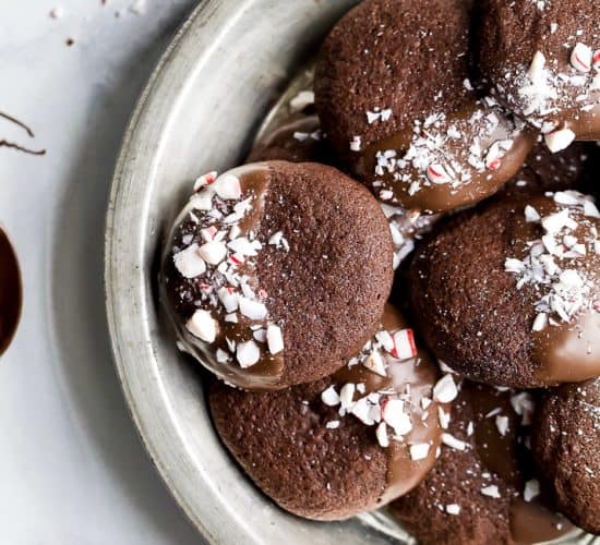 gluten free chocolate cookies sprinkled with peppermint candy in a serving dish