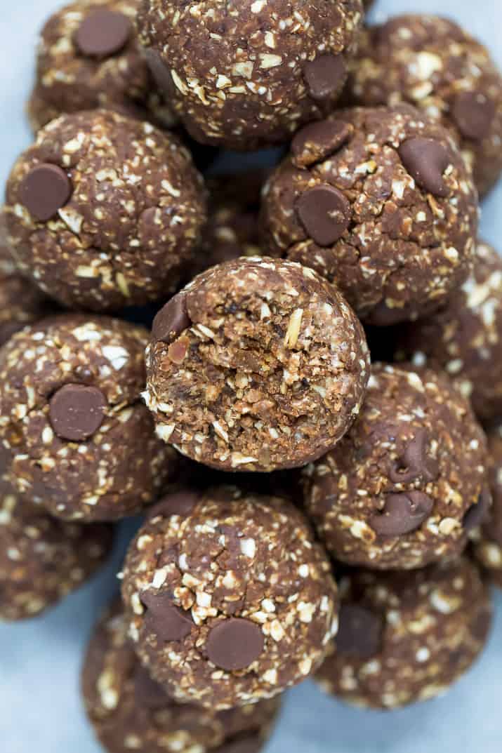 close up photo of a chocolate brownie energy ball with a bite in it