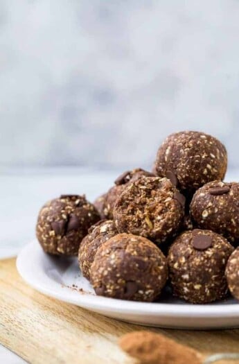 chocolate brownie energy balls piled on a plate