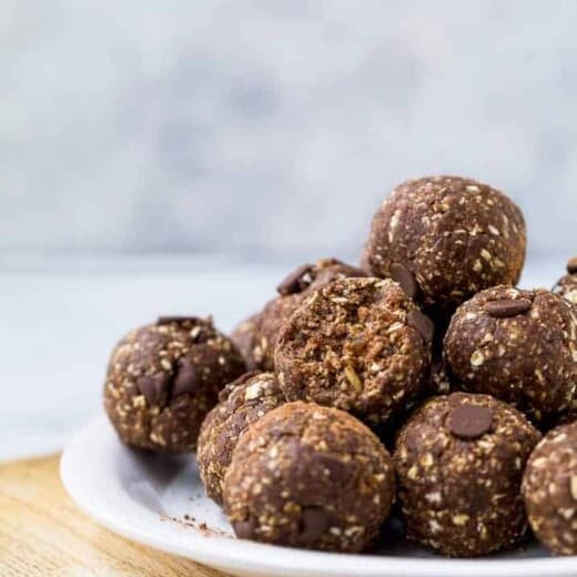 chocolate brownie energy balls piled on a plate