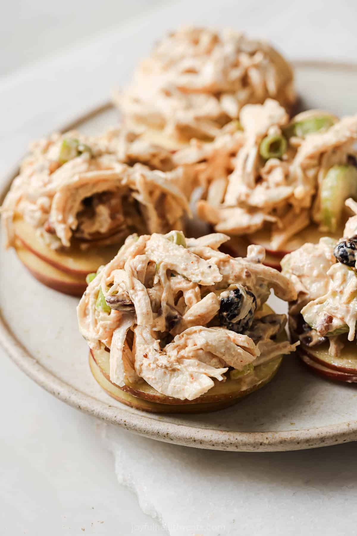 Cranberry chicken salad over sliced apples.