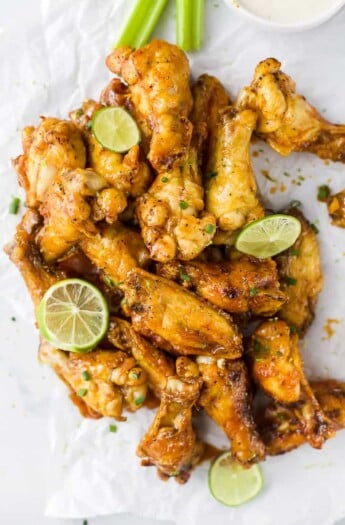 a pile of crispy baked chili lime chicken wings