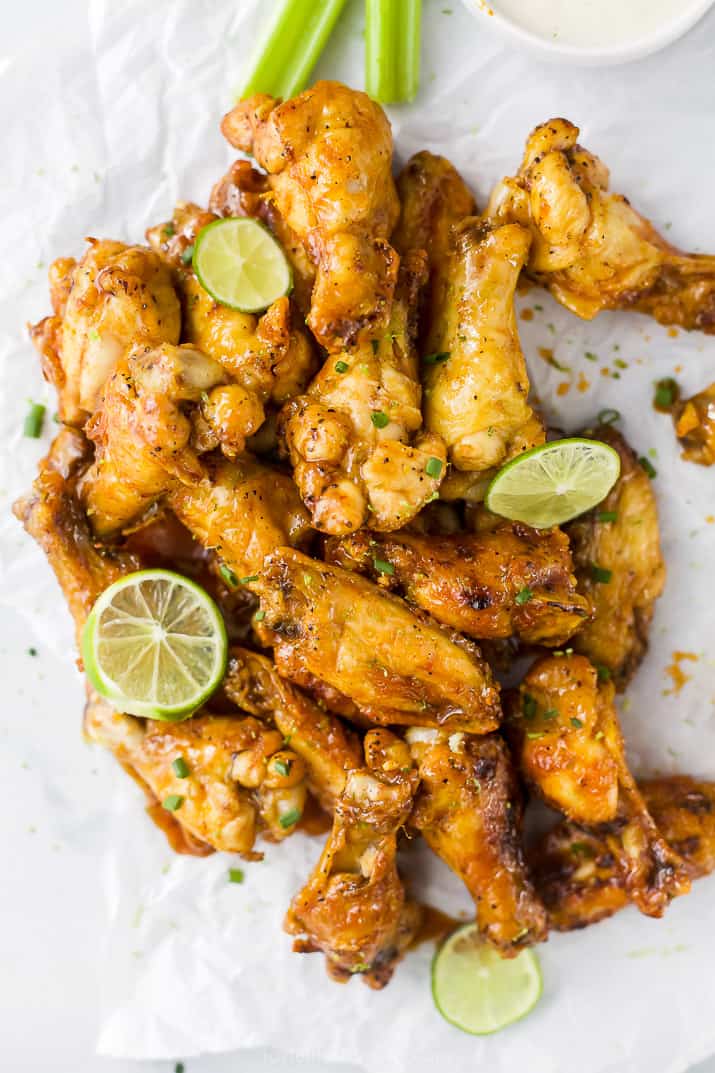 a pile of crispy baked chili lime chicken wings