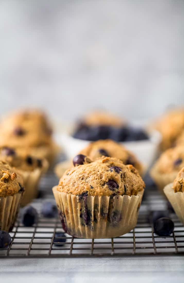 picture of healthy banana blueberry muffins on a cooling rack