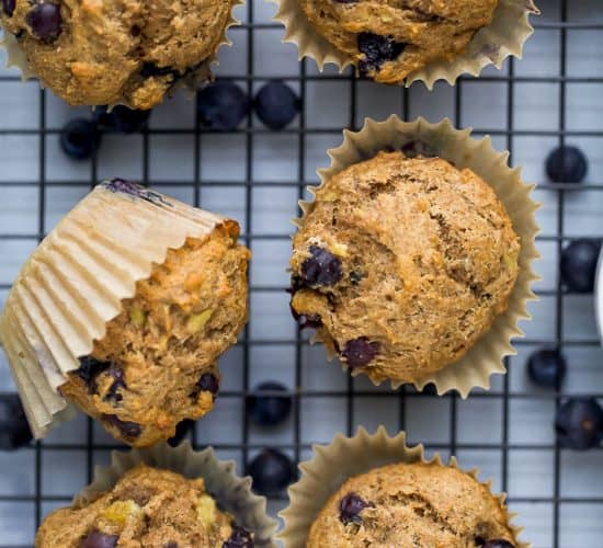 picture of healthy banana blueberry muffins on a cooling rack