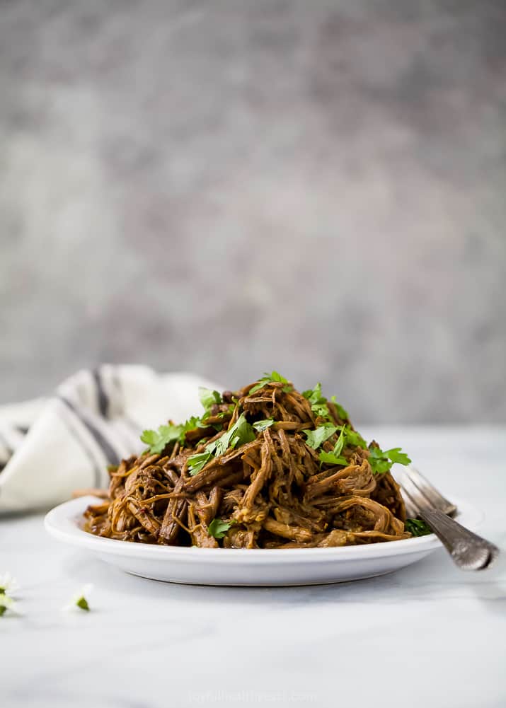 photo of healthy instant pot chipotle beef barbacoa on a plate