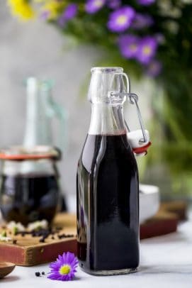 homemade elderberry syrup in a container