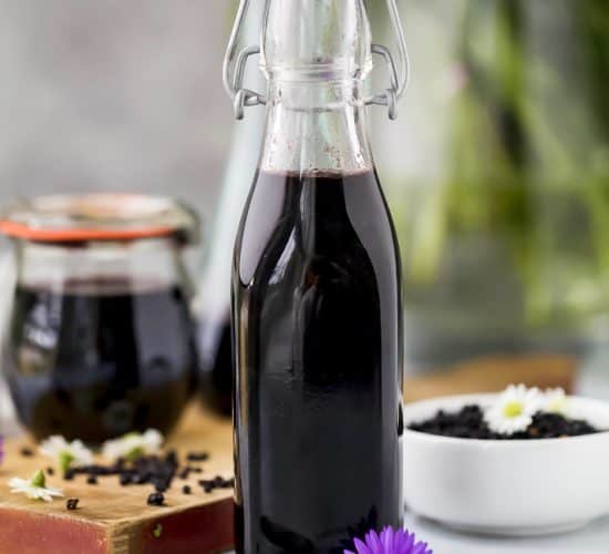 homemade elderberry syrup in a container