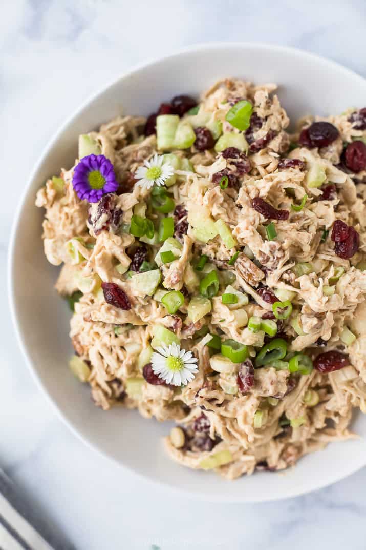 Cranberry chicken salad in a bowl with flowers