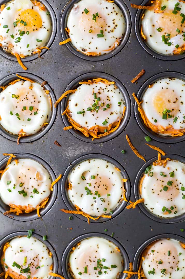 sweet potato hash baked egg cups in a muffin tin before being removed