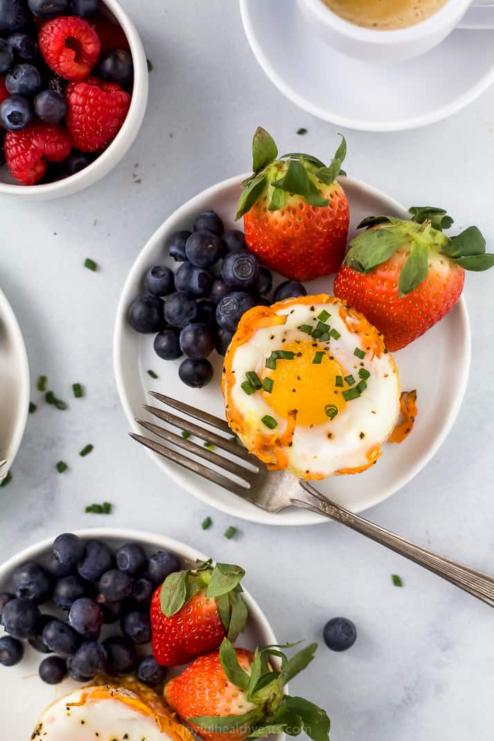 close up photo of sweet potato hash baked egg cups with fresh fruit