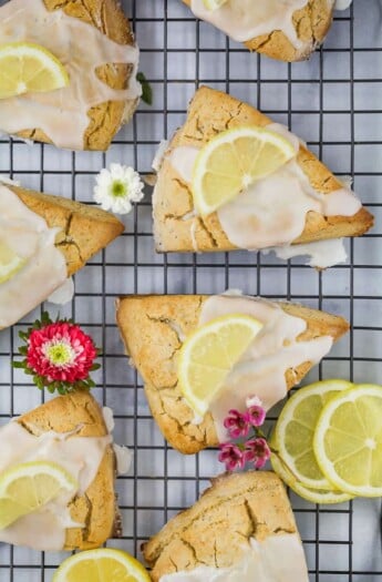 gluten free lemon poppy seed scones with a lemon glaze and lemon slice on top