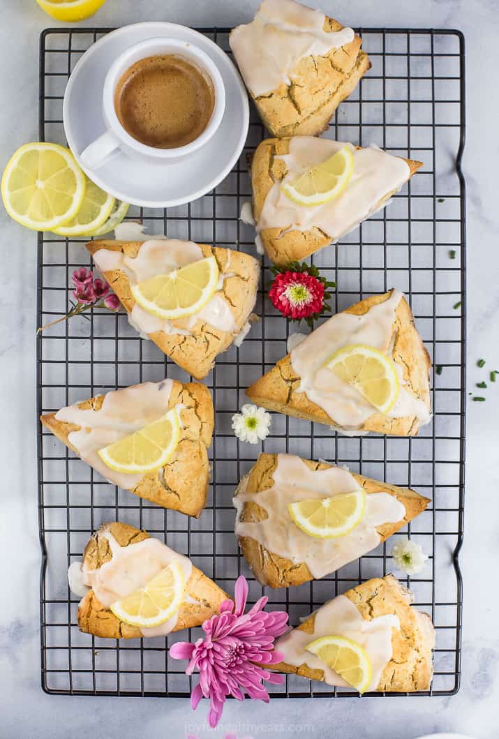 gluten free lemon poppy seed scones with a lemon glaze and lemon slice on top