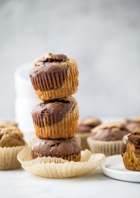 Crazy Moist Healthy Marbled Chocolate Banana Muffins stacked on top of each other