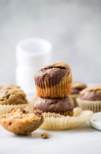 moist healthy marbled chocolate banana muffins stacked on top of each other