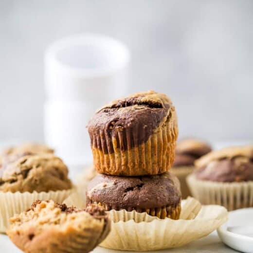 moist healthy marbled chocolate banana muffins stacked on top of each other