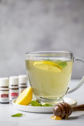 Wellness Thieves Tea in a cup with lemon