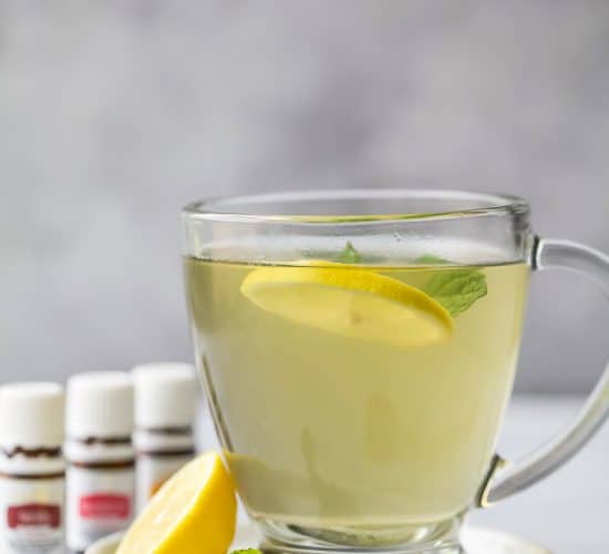 Wellness Thieves Tea in a cup with lemon