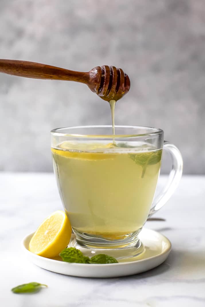 Wellness Thieves Tea in a cup with lemon 