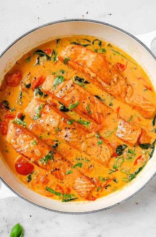Tuscan salmon in a pan.