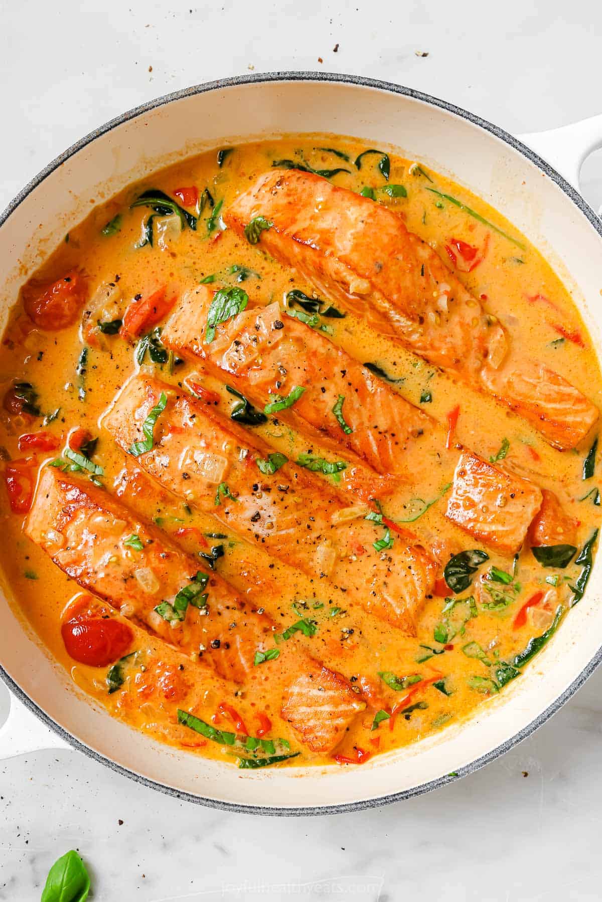 Tuscan salmon in a pan. 