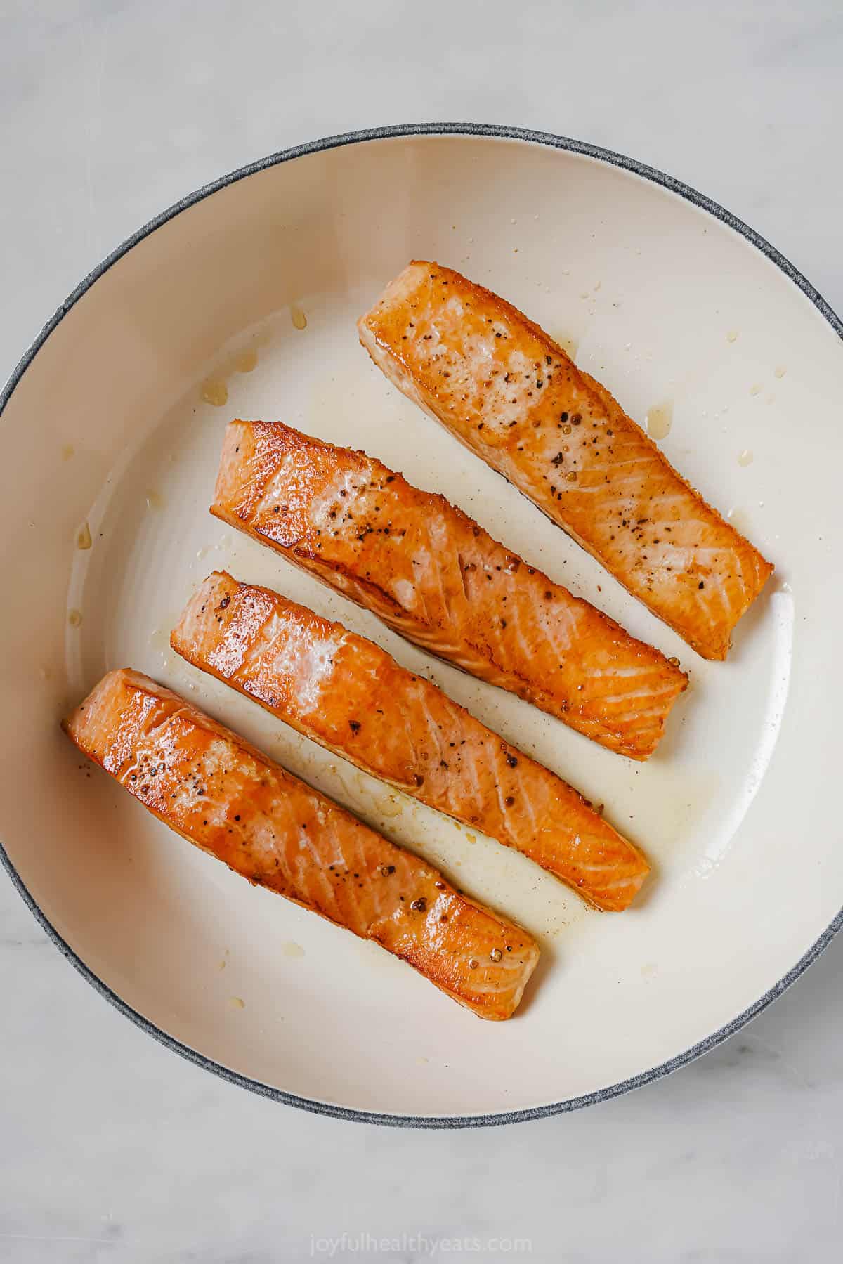 Searing the salmon. 