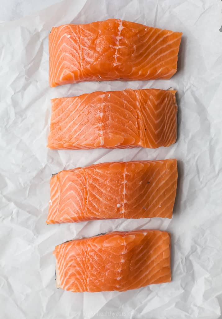 fresh salmon filets on parchment