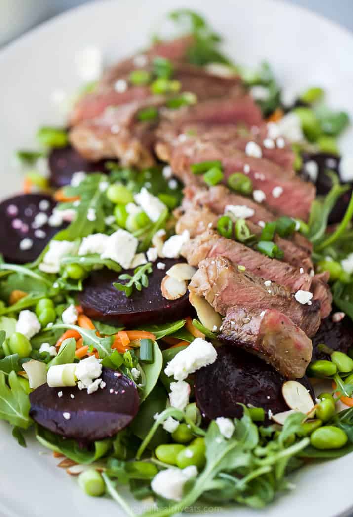 close up photo of pan seared steak on a roasted beet salad