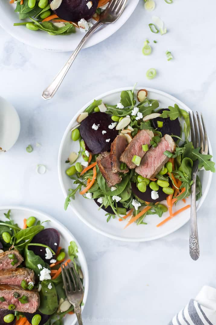 roasted beet steak salad on multiple plates