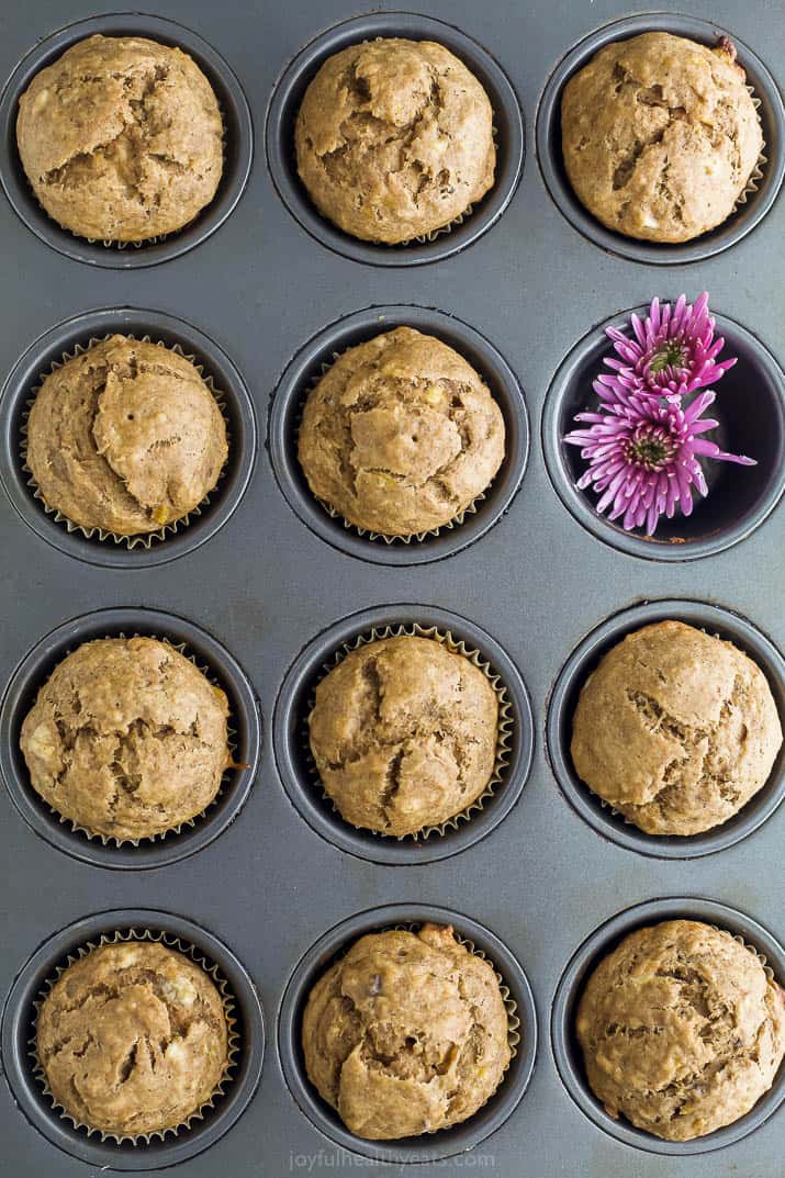 A 12-count muffin tin containing banana breakfast muffins in all but one muffin divot