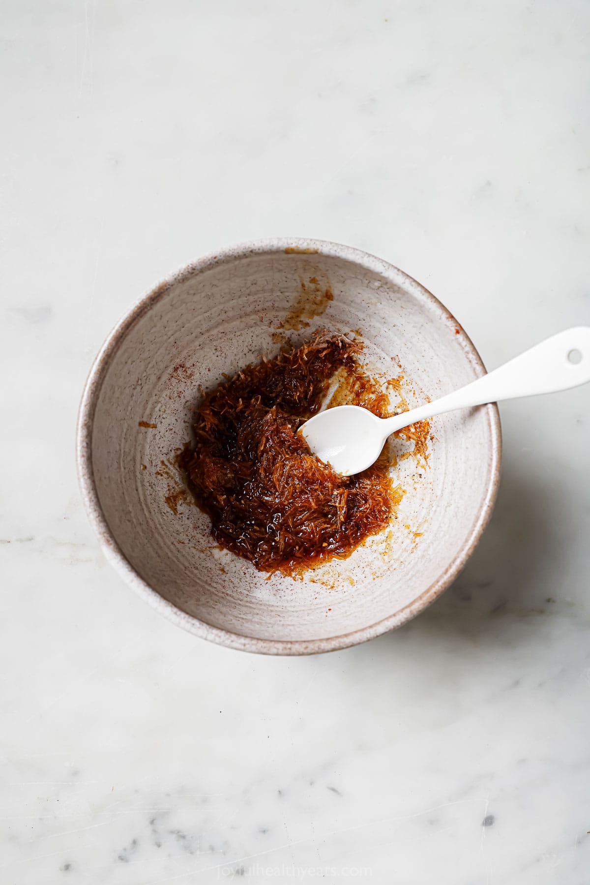 Garlic-parmesan mixture in a small bowl. 